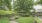 Gazebo with walkway surrounded by trees