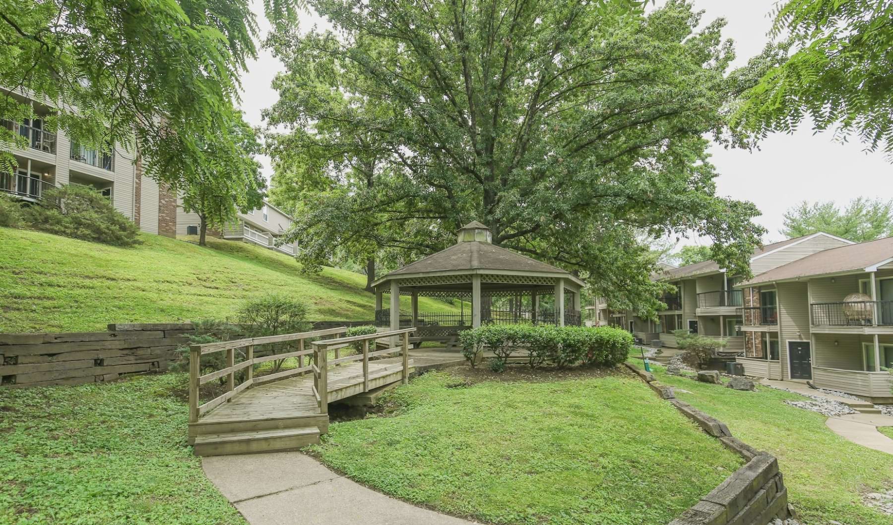 Connect or read a book at our gazebo Gazebo with walkway surrounded by trees