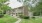 Apartment building with path surrounded by trees